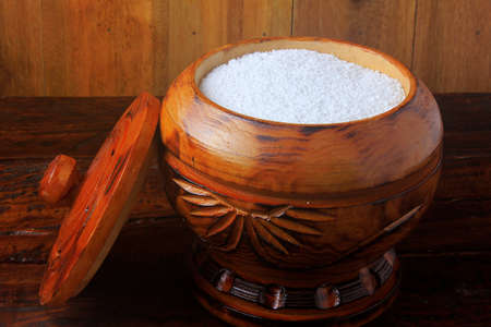 tapioca flour in wooden bowl on wooden background. Ingredient extracted from cassava (manioc)の写真素材