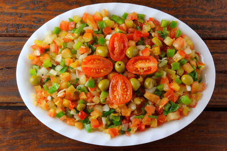 Vinagrete or Vinaigrette is a traditional Brazilian cuisine salad made with tomatoes, peppers, onions, vinegar, parsley and olives. Top viewの写真素材
