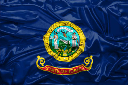 Flag of Idaho state of United States of America on soft and smooth silk texture. 3D renderingの写真素材