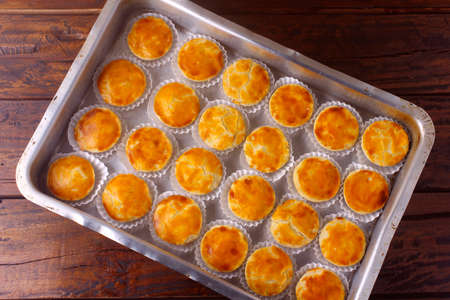 Empada or empadinha is a very popular and traditional snack of Brazilian cuisine, it is a small savory pie stuffed with chicken or shrimp. Top viewの写真素材