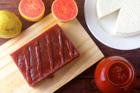 guava candy in bar known in Brazil as Goiabada, isolated on wooden board. Guava sweet dessertの写真素材
