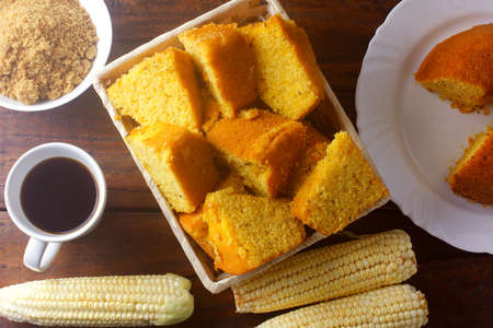 corn cake sliced in basket on rustic wooden table for breakfast. Typical Brazilian food. Top viewの写真素材