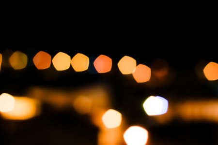 background abstract street night orange lights with bokeh effect. street photographyの写真素材