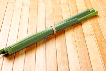 portion of dried organic lemongrass on rustic wooden table. close up view