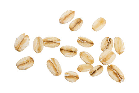 Raw organic oat flakes isolated on white background. Macro photography for packaging. top view