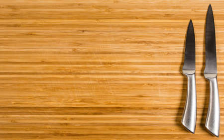 Kitchen knife on a cutting boardの写真素材