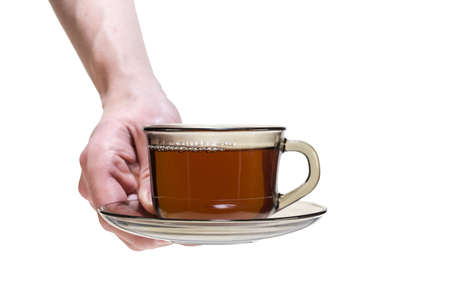 Hand holding a cup of tea isolated on whiteの写真素材