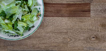Fresh salad on a wooden tableの写真素材