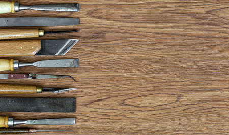 Set of craft tools on wood backgroundの写真素材