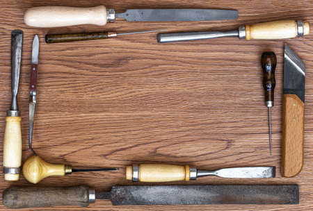 Set of craft tools on wood background