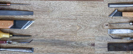 Set of craft tools on wood background
