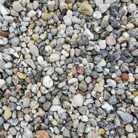 Texture of gravel stones on ground background