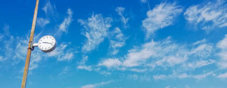 clock in the sky with cloudsの写真素材