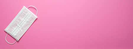 medical mask on pink background. Protection concept in the time of coronavirus