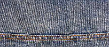 texture of blue jeans denim fabric backgroundの写真素材