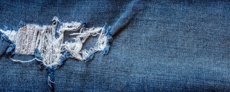 texture of blue jeans denim fabric backgroundの写真素材