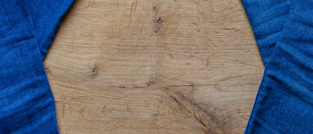 blue jeans on wooden surface backgroundの写真素材