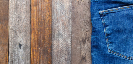 blue jeans on wooden surface backgroundの写真素材