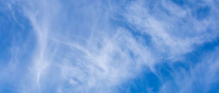 blue sky with white clouds and sun light. Nature background of sky