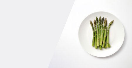 white plate with green asparagus on gray background. Created with Generative AIの素材