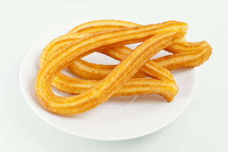 Typical spanish fried pastry in a dessert dish.の写真素材