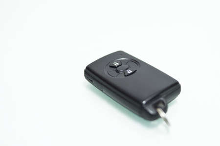 Car key with integrated remote, isolated on white.