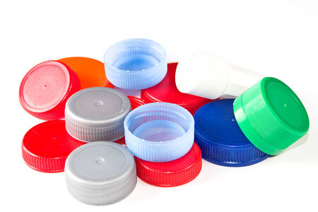 Colorful plastic caps isolated in whiteの写真素材