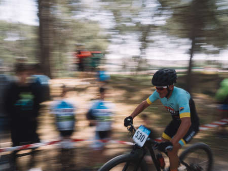 Cadiz, Spain - 24 March 2019: Participants of the third edition of the mountain bike championship. Photographs made with the sweeping technique.のeditorial素材