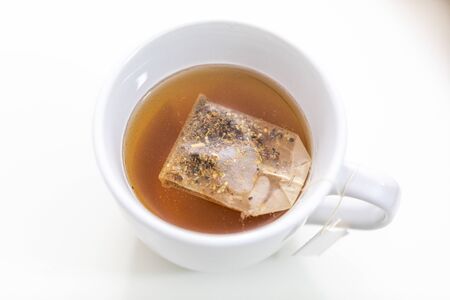 Cup of hot tea on a deskの写真素材