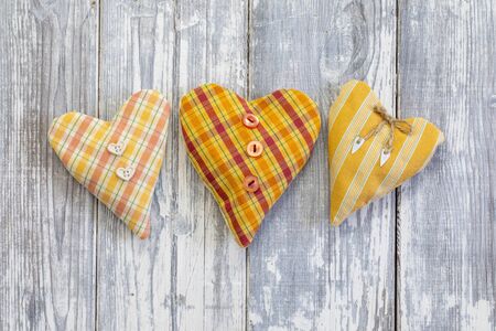 Heart shape placed on wooden background