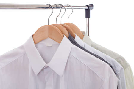 Clothes hanger with shirts isolated on white