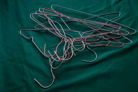 Close-up of a group of hooks on a green background