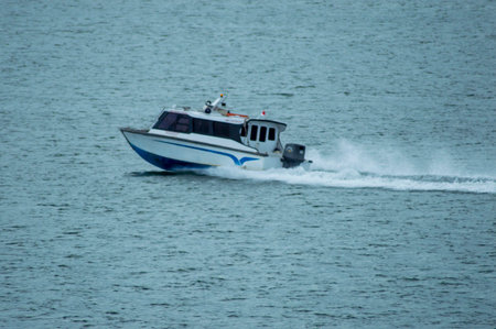 Batam, Indonesia - July 8, 2024: view of a speeding passenger speed boatの写真素材