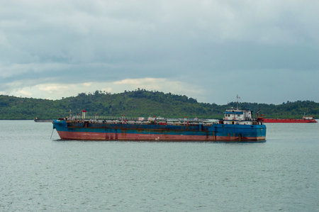 Bulk cargo ship in the sea with cloudy sky, Thailand.