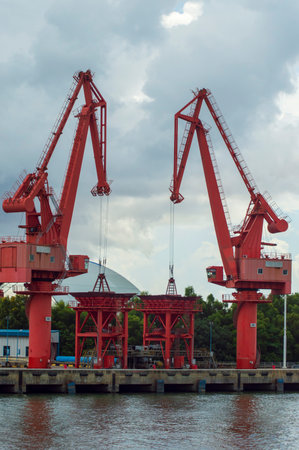 Batam, Indonesia. 7 July 2024. Grab crane, a tool used for loading and unloading cargo from ships.