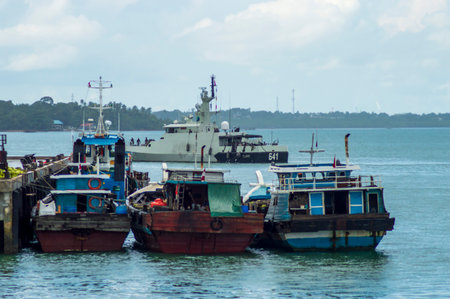 Fishing boats moored in the sea at the coast of Thailand