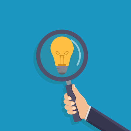Looking for ideas, business hand holding a magnifying glass, light bulb, flat design vector illustrationのイラスト素材