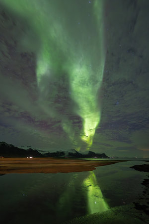 Aurora borealis, northern lights over the sea at nightの写真素材