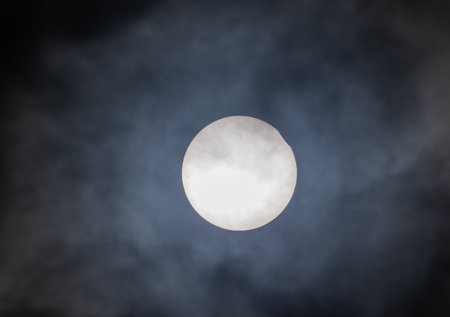 Full moon in the dark night sky with clouds and stars, natural backgroundの写真素材