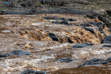 Rocks and water in the river. Natural background and texture.の写真素材