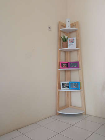 Wooden shelf furniture in the corner of the living roomの写真素材
