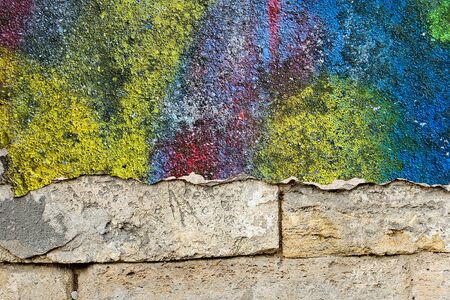 Blank background for your text. The texture of a grunge old street on the facade wall with cracked paintの写真素材