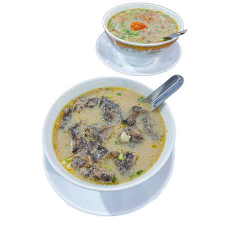 Top View of Coto Makassar, traditional food of South Sulawesi, Indonesia. Made with beef and many...