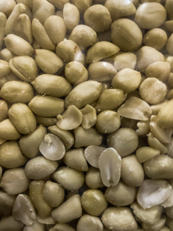 Closeup view of pealed peanuts as food background