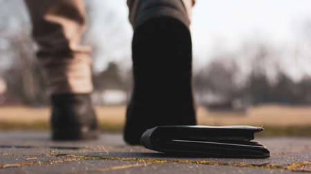 Someone drops his walletの写真素材