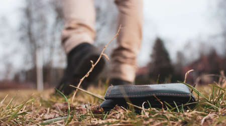 Man walks away from lost wallet, lost object