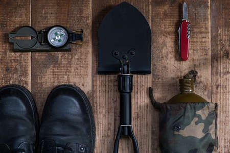 Camping layout of things on dark wooden background. The concept of tourism, outdoor activities.の写真素材