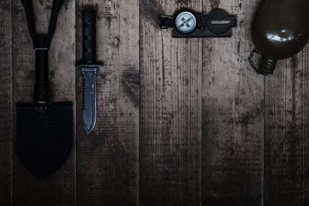 Camping layout of things on dark wooden background. The concept of tourism, outdoor activities.の写真素材