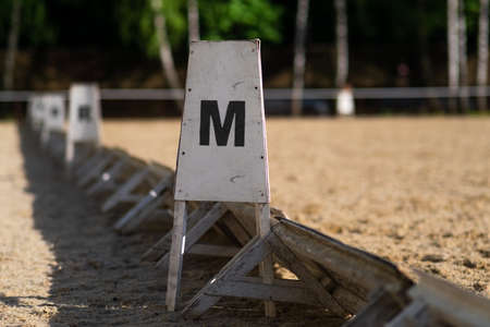 The equestrian competitions. dressage field. columns with letters