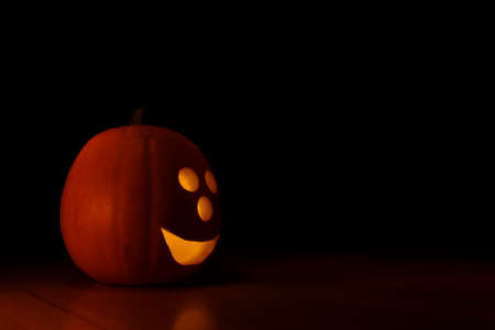 Halloween pumpkin with copy space (black background)の写真素材